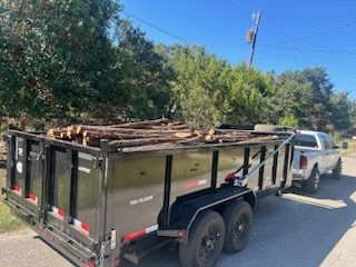 Dump trailer hauling debris / logs